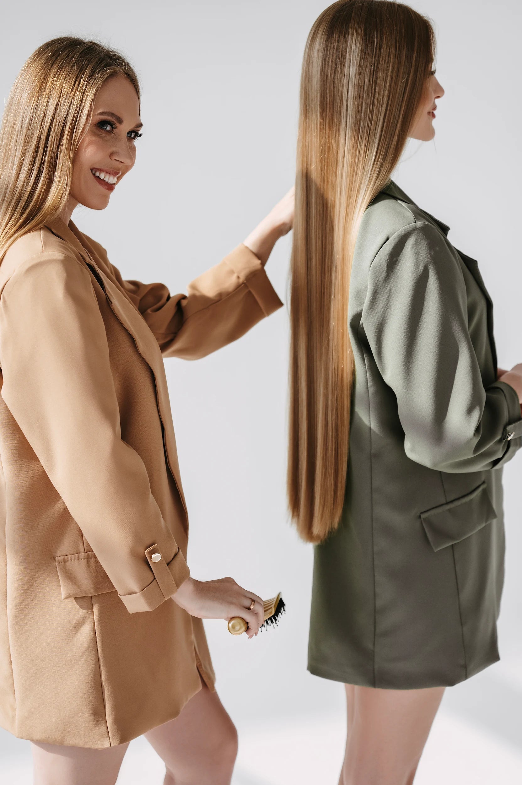 Two models with very long blonde and dark hair