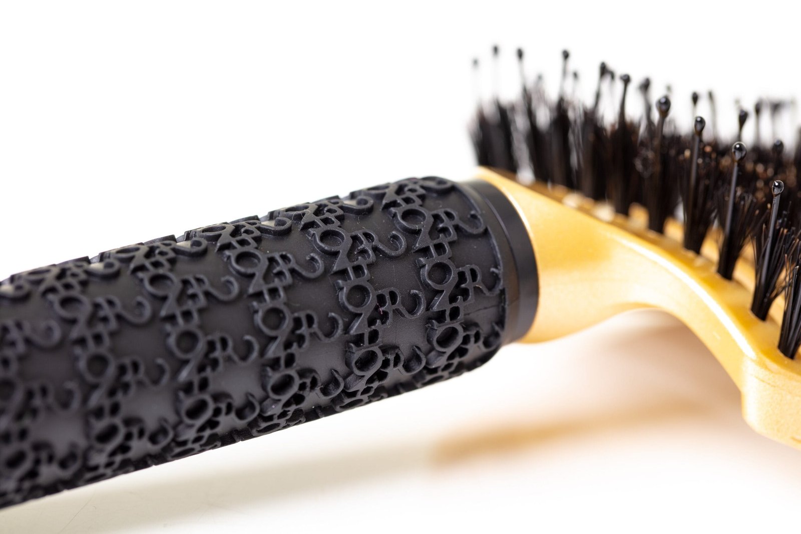 Close-up of the patterned handle of a hair comb