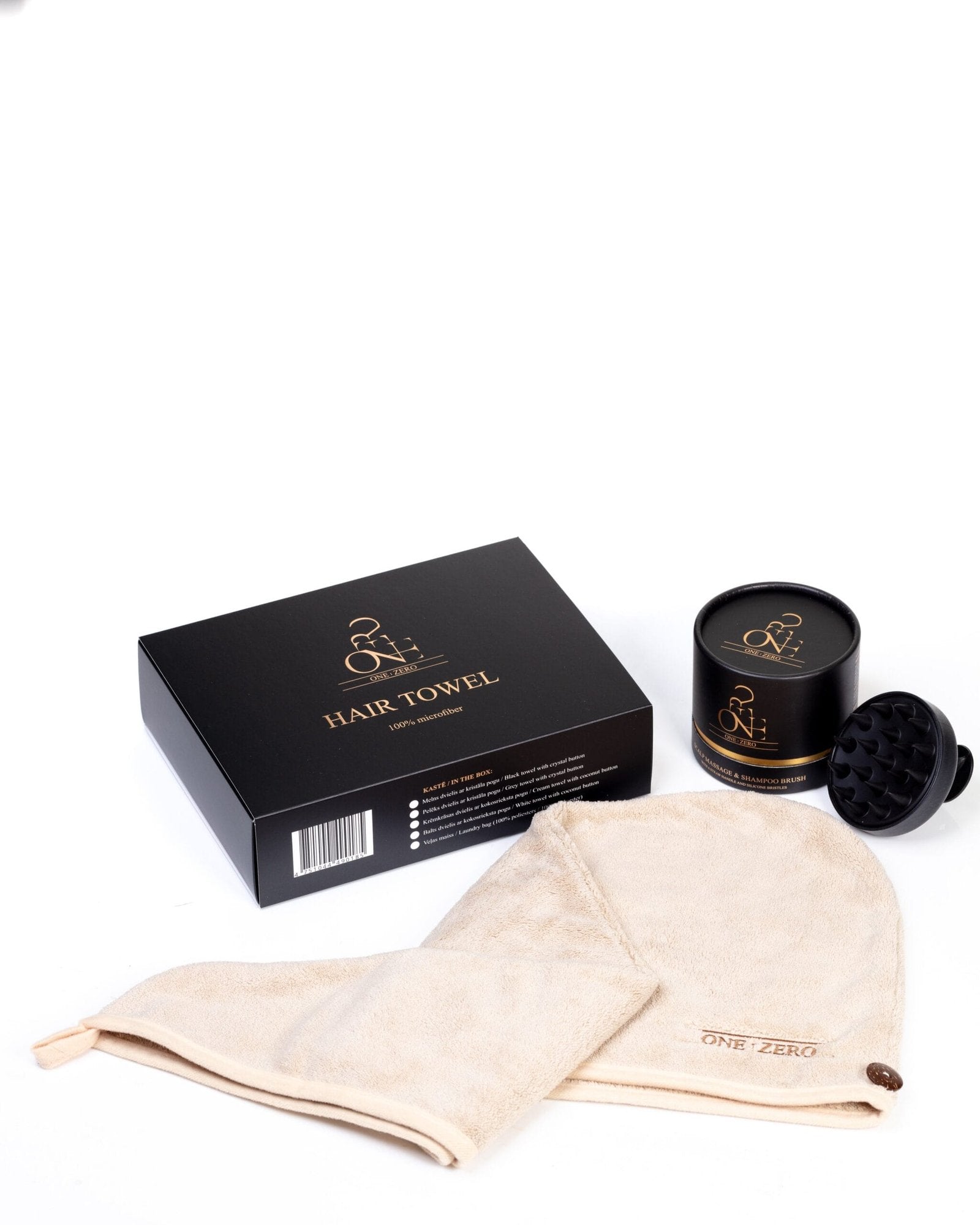 Cream-colored hair towel with a coconut button next to the gift box