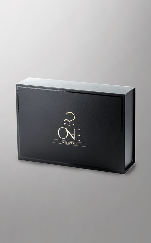 Black ONE:ZERO gift box with a gilded logo